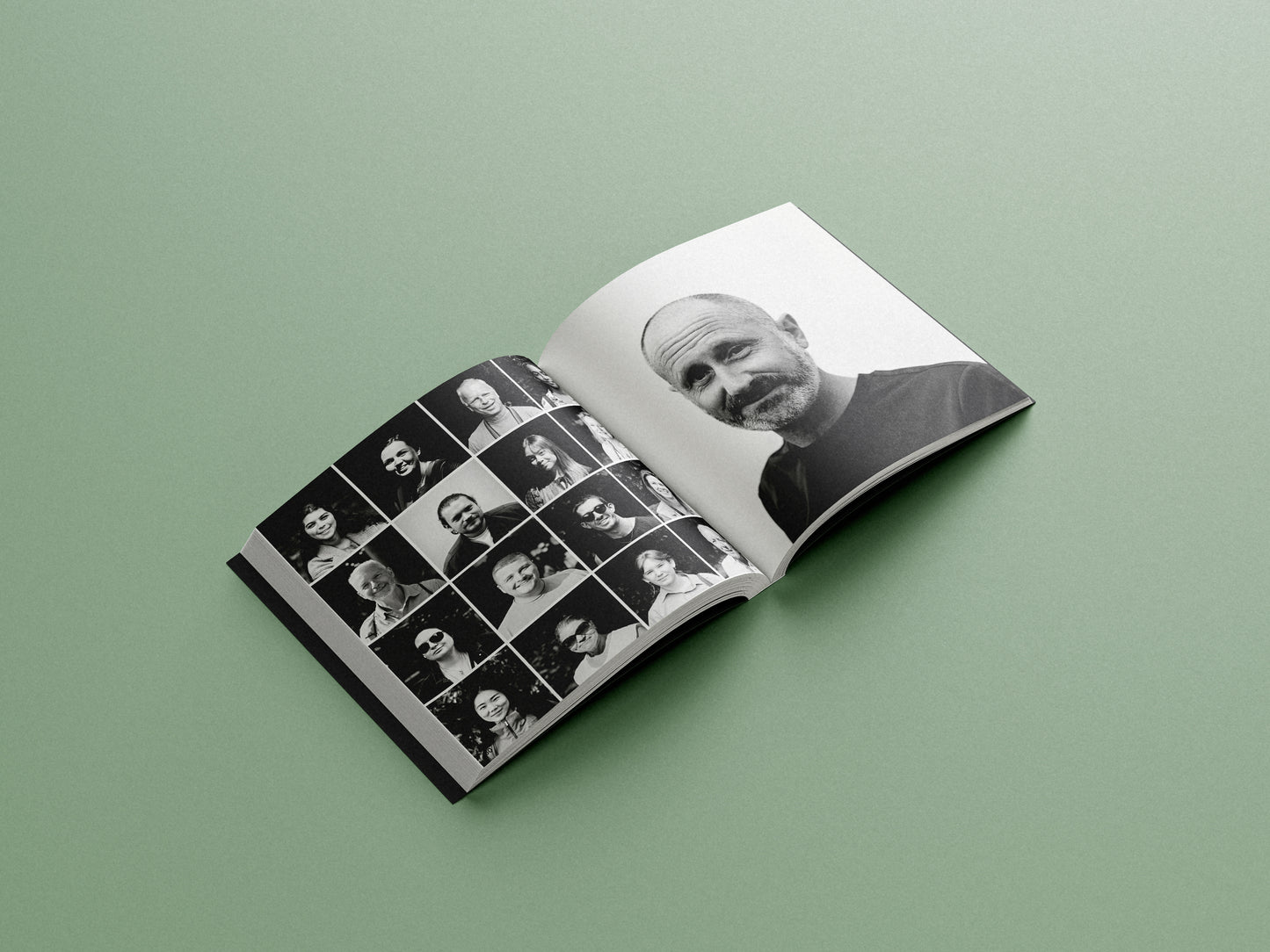 Open book with black and white photographs on a green background